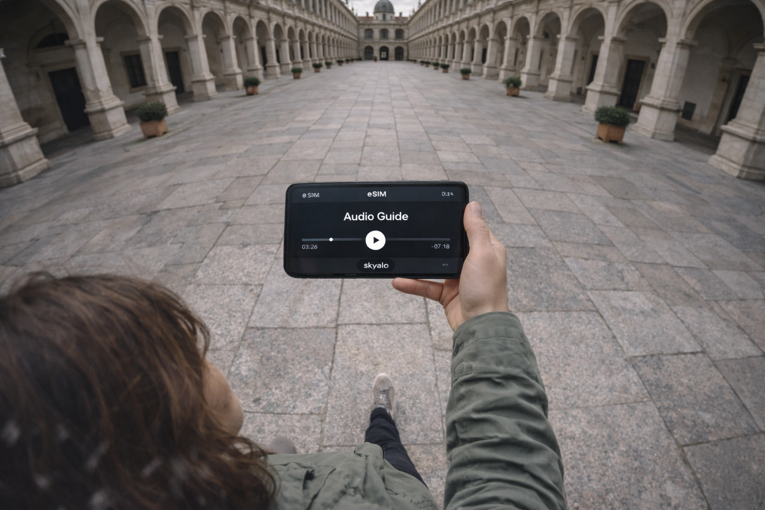 Listening to the Hofburg audioguide via a smartphone with an eSIM for traveling in Austria