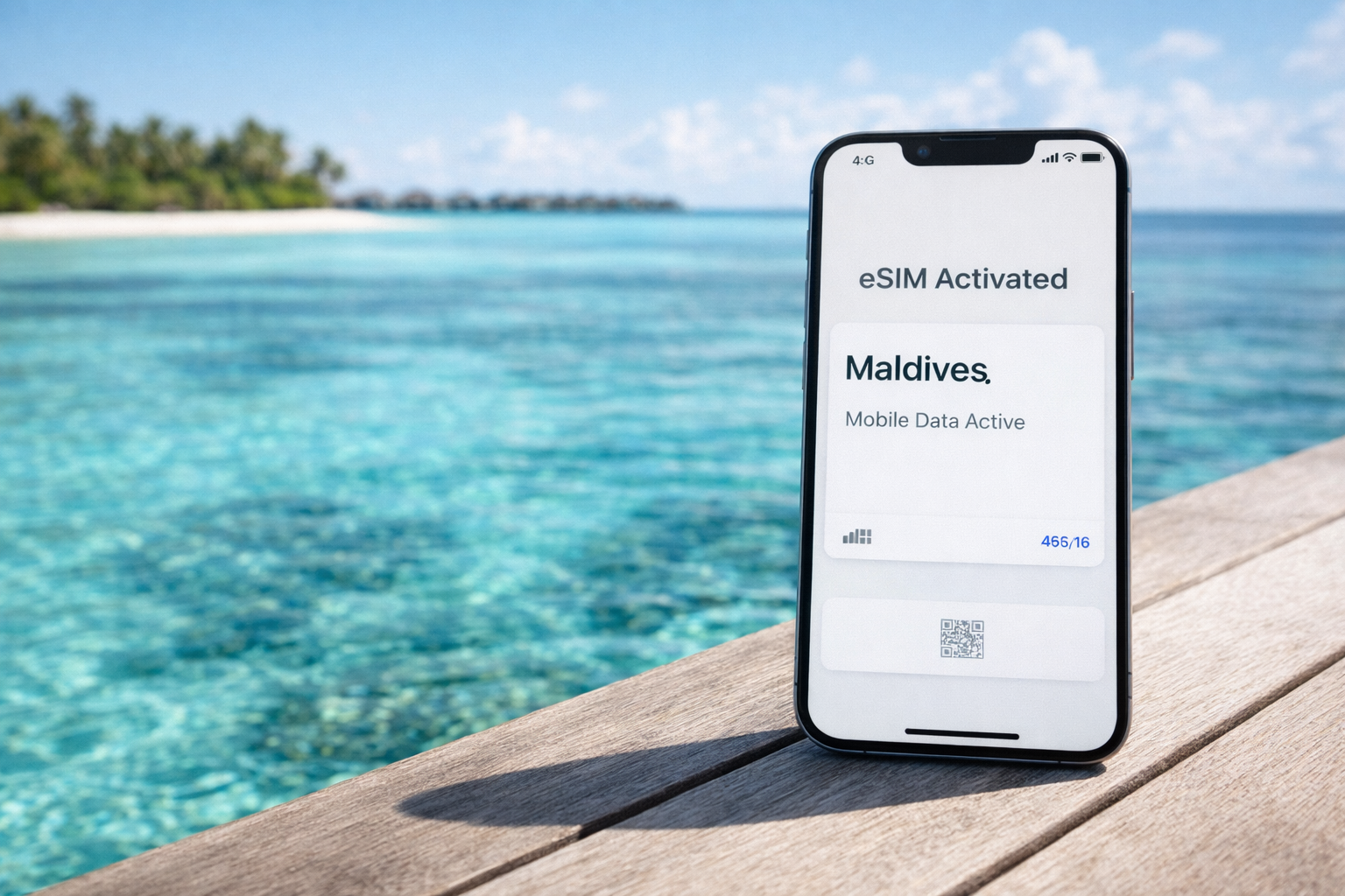 A smartphone with an activated Maldives eSIM against a backdrop of a turquoise lagoon and overwater villas