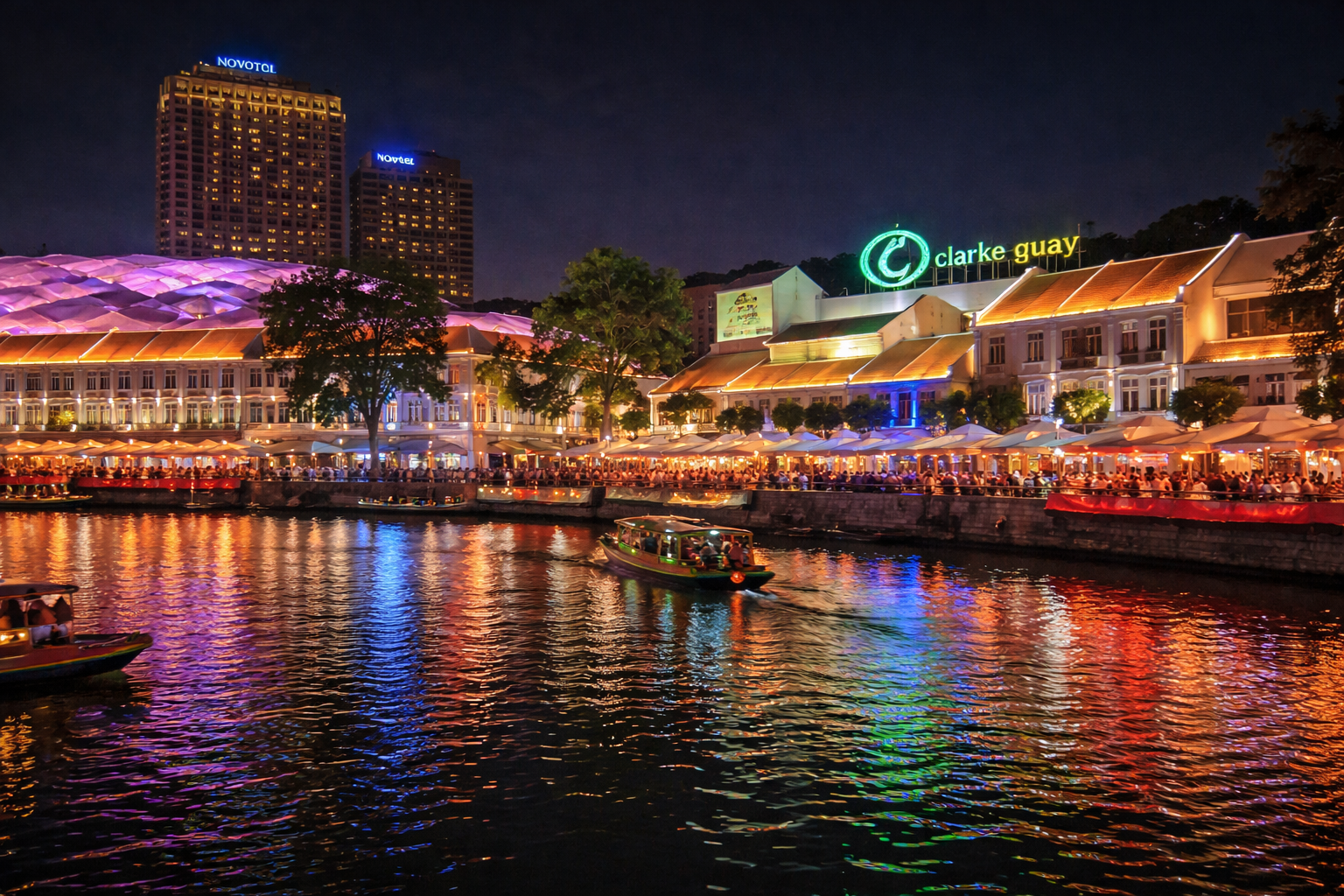 Clarke Quay waterfront in the evening with bright lights.