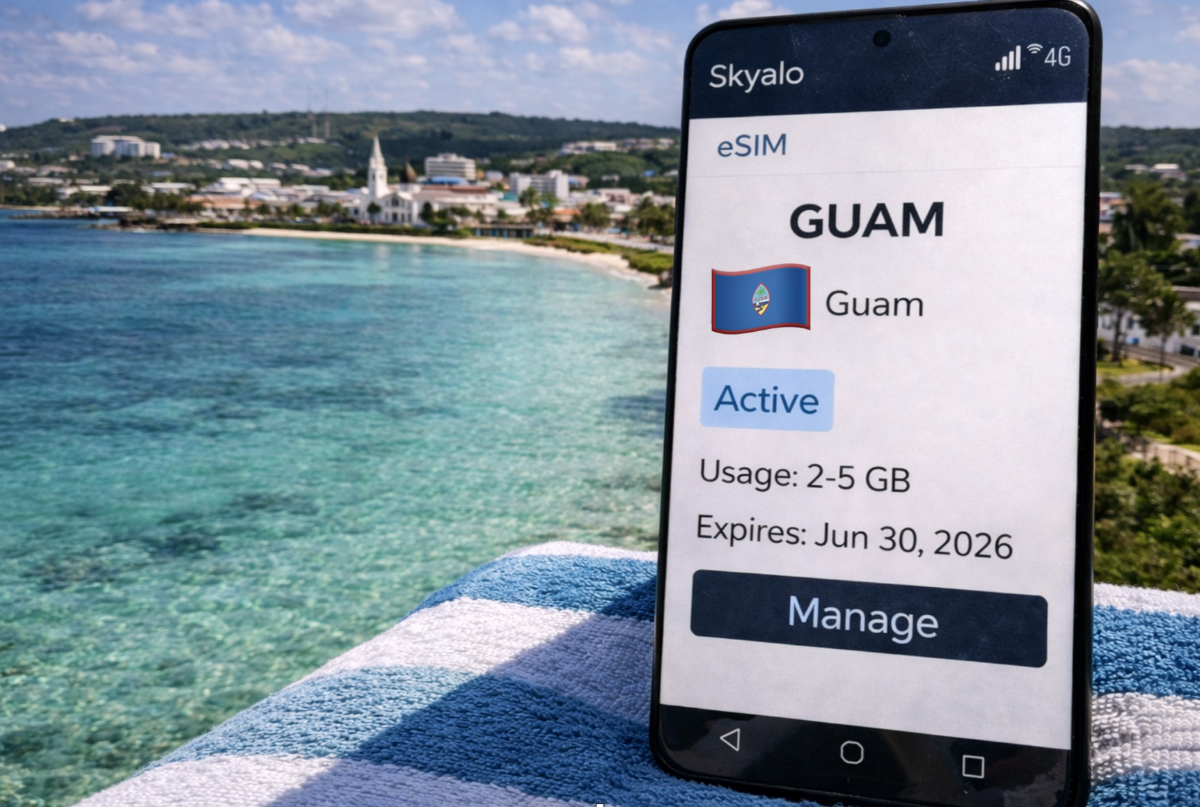 A smartphone with an active Skyalo eSIM for Guam on screen, with Hagåtña coastline and turquoise ocean in the background