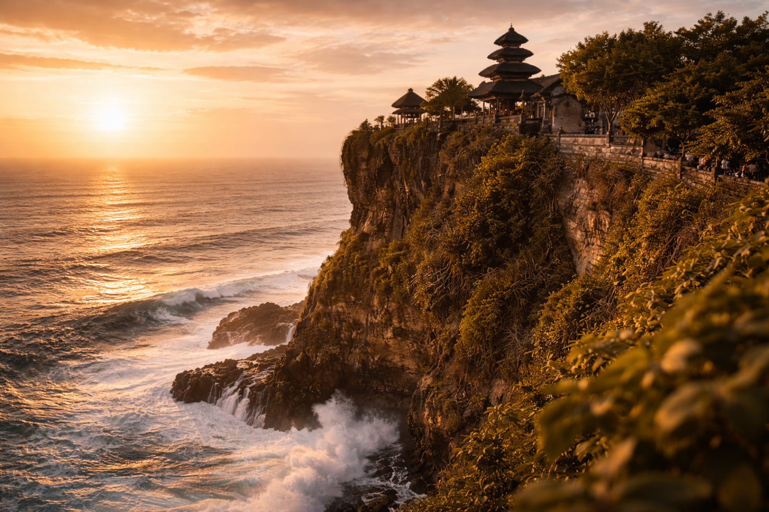 Uluwatu Temple on a cliff above the ocean during golden hour