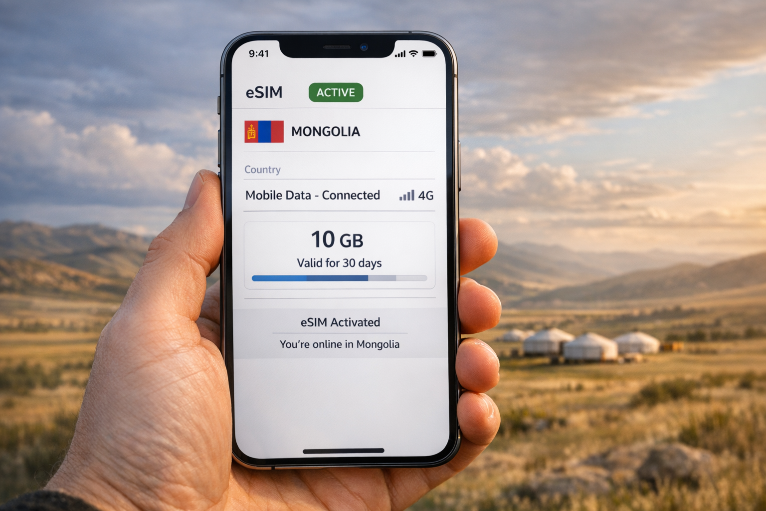 Smartphone con una eSIM activada para Mongolia en pantalla, sobre un paisaje de estepa